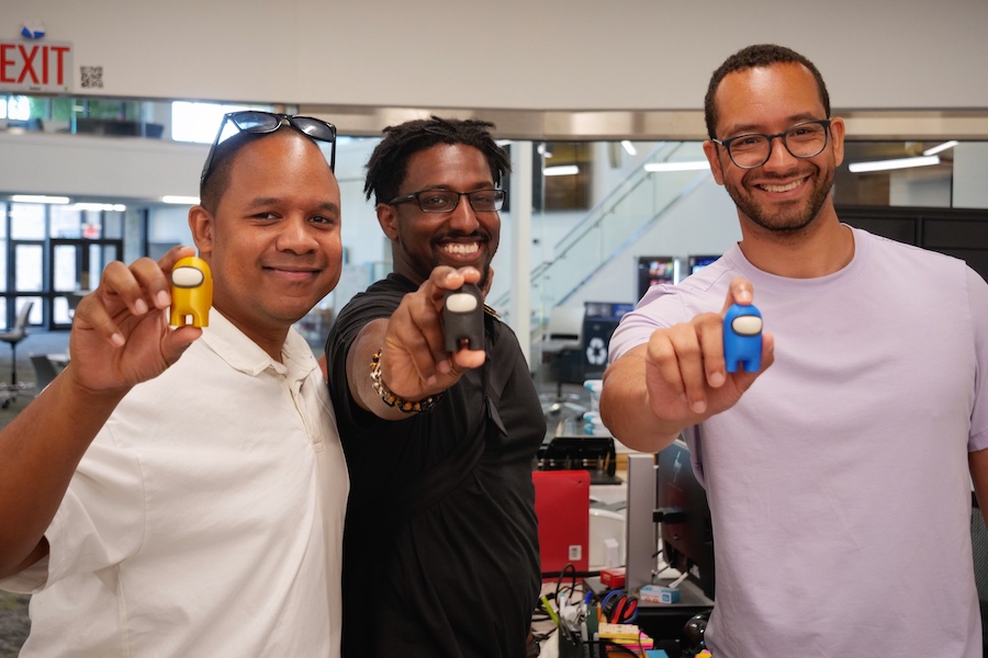 University alumni showing off products.