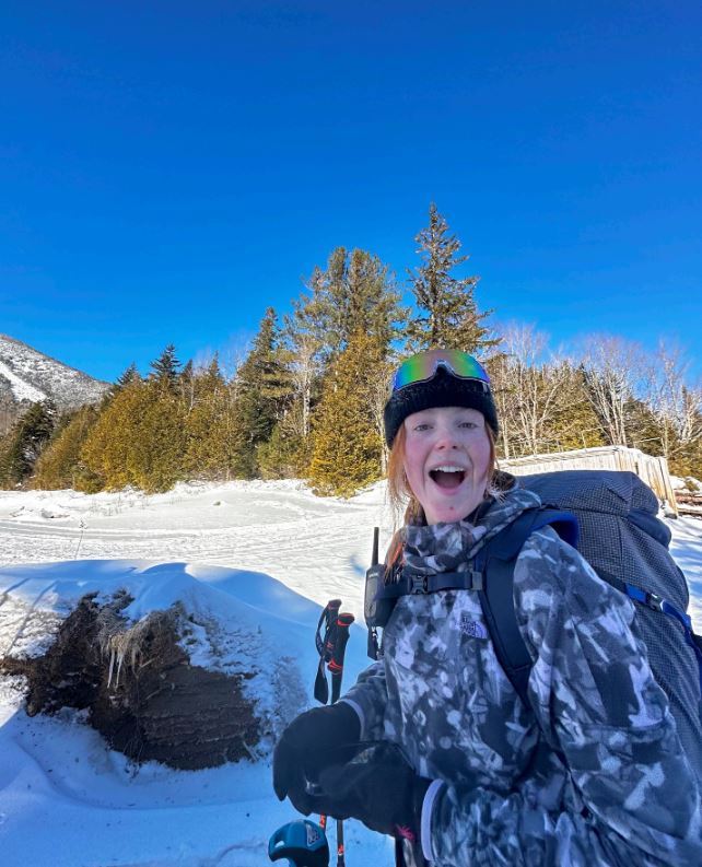Female student cross country skiing